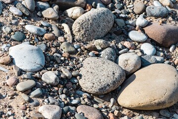 Natural background with stones on the sand
