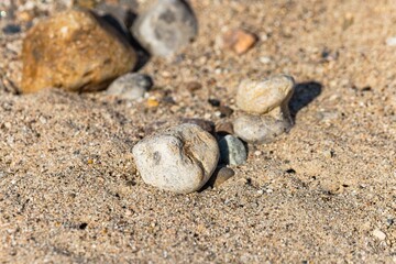 Natural background with stones on the sand