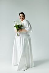 A radiant plus size bride beams in a flowing white gown, holding a beautiful bouquet on a muted...