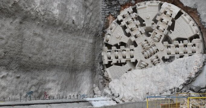 Tunnel boring machine(TBM) head on display at subway construction site ,underground infrastructure transportation