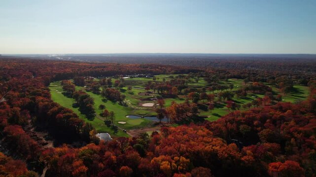 Incredibly gorgeous golf course in golden fall forest, 4K