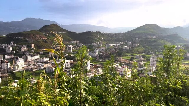 Ibb city pan top-down view of green city in Yemen