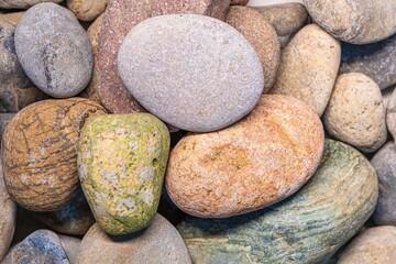 Natural natural stones of different colors with a slightly textured surface