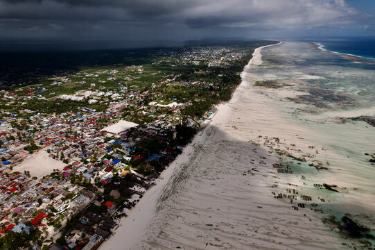 Aerial view of beautiful east coast beaches with storm clouds over the turquoise ocean, Paje, Tanzania.