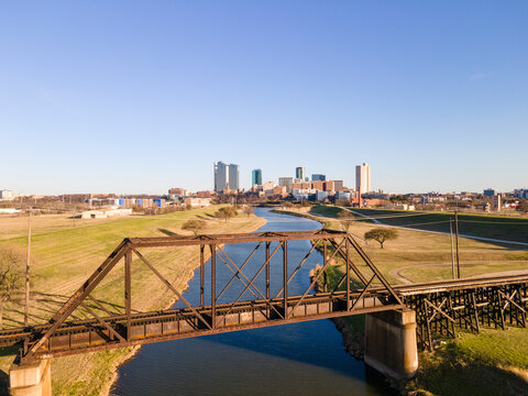 Aerial view of beautiful urban landscape with bridge over river and modern buildings, Fort Worth, United States.