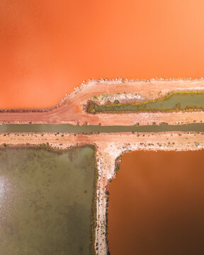Aerial view of Hutt Lagoon with vibrant pink water and geometric shapes, Yallabatharra, Australia.