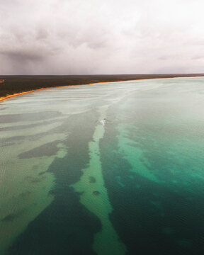 Aerial view of beautiful turquoise ocean and serene sandy beach, Monkey Mia, Shark Bay, Australia.