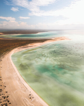 Aerial view of shell beach with turquoise clear water and sandy coastline, Shark Bay, Australia.