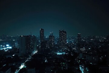 High-rise building view of city at night, great for architecture or urban planning images