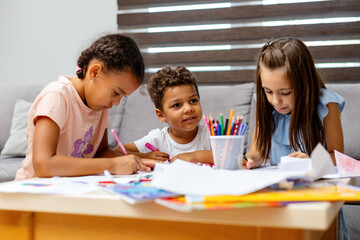 Kids engaging in creative art activities together happily