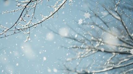 Snowflakes falling against a soft blue sky, showcasing the delicate beauty of winter with intricate, crystalline snow patterns.