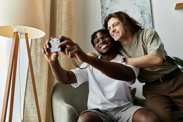 Two partners happily pose for a selfie while embracing in their cozy living room.