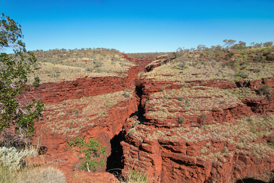 Aerial view of joffre gorge with majestic red rock formations and rugged landscape, karijini national park, pilbara region, australia.