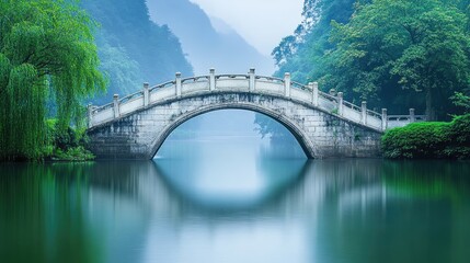 Fototapeta premium Serene Bridge Over Calm Water in Misty Landscape
