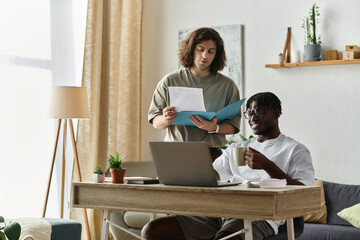 Two partners collaborate joyfully at home, sharing ideas and a warm moment over coffee.