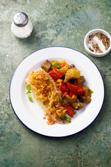 White fish fillet with onion crunch and vegetables