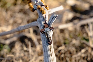 Religious Christian theme with Biblical concept of Jesus Christ crucified on the cross for the holiday of Palm Sunday or Christmas