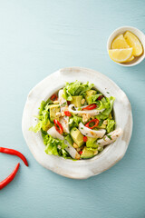 Squid salad with avocado and peanuts