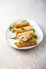 Crepes with creamy filling and raisins