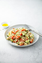 Healthy quinoa salad with tomatoes and cucumber