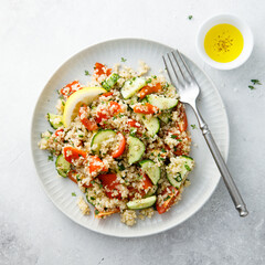 Healthy quinoa salad with tomatoes and cucumber