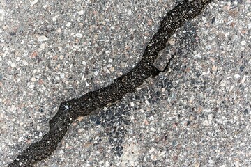 Asphalt with destroyed cracked surface for textures or layouts