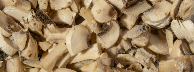 Background made of Frozen food sliced mushrooms champignon homemade. Harvesting concept. Stocking up vegetables for winter storage