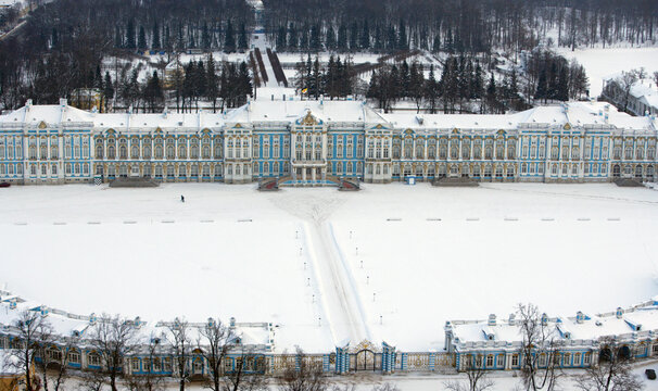 Aerial view of catherine's palace surrounded by a snowy forest, pushkin, russia.