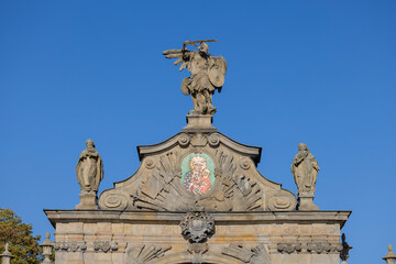 Czestochowa, Poland - October 18, 2024: 14th century baroque Jasna Gora Monastery,  famous pilgrimage center. Lubomirski Gate with mosaic of Our Lady Queen and sculpture of St. Michael the Archangel