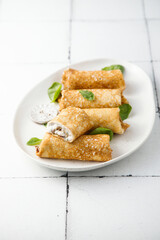 Crepes with creamy filling and raisins