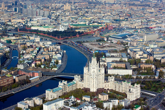 Aerial view of breathtaking cityscape with historic architecture and iconic bridge over the river, Moscow, Russia.