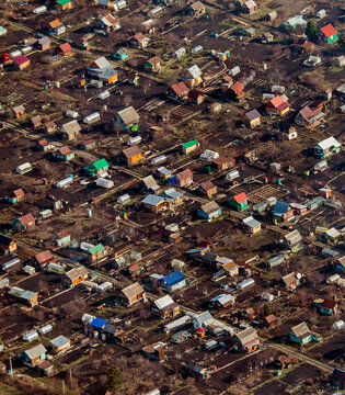 Aerial view of suburban residential district with houses and rooftops, Beloretsk, Bashkortostan Republic, Russia.