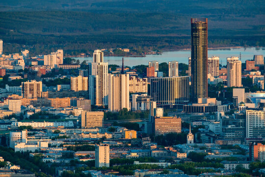 Aerial view of vibrant cityscape with modern skyscrapers and bustling urban life, Ekaterinburg, Russia.