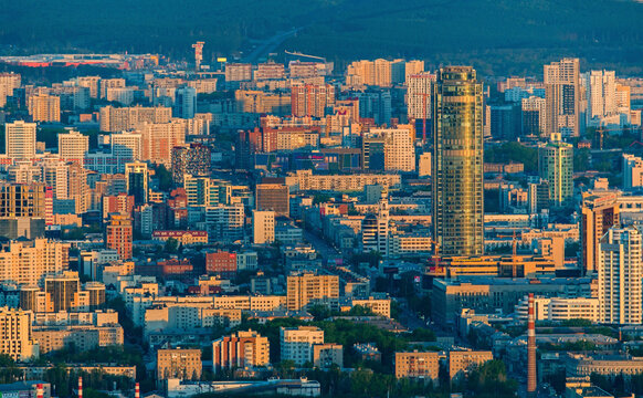 Aerial view of beautiful high-rise buildings and vibrant skyline at sunset, Ekaterinburg, Russia.