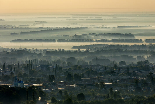 Aerial view of serene forest landscape shrouded in mist at dawn, Usman, Lipetsk Oblast, Russia.