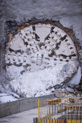Tunnel boring machine(TBM) head on display at subway construction site ,underground infrastructure transportation