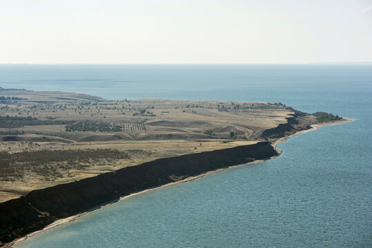 Aerial view of serene gulls over the tranquil coast of Tsimlyansk Reservoir, Volgograd Oblast, Russia.