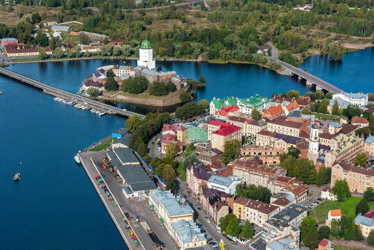Aerial view of picturesque Vyborg with its historic castle, scenic river, and vibrant urban landscape, Leningrad Oblast, Russia.