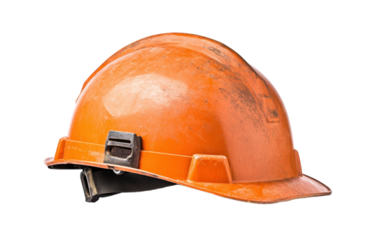 An worn orange hard hat resting on a white background highlighting construction safety equipment