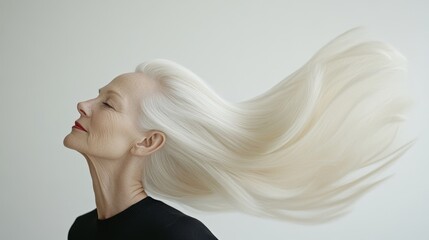 Naklejka premium Graceful woman with flowing white hair.