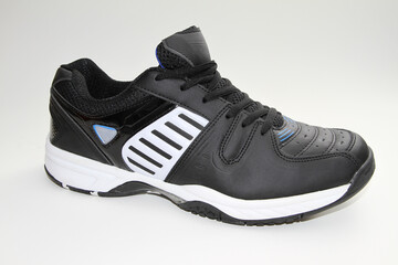 Men's sneakers. White background. Side view. Unbranded shoe model.