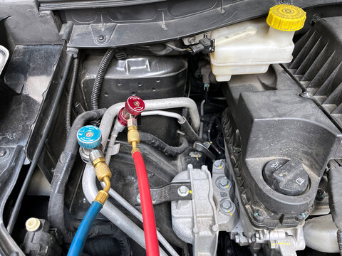 ac manifold guage is used during car air conditioning ac refrigeration recharge system process , testing pressure , leaking of ac coolant r134 r22 maintenance in the garage before going a long travel