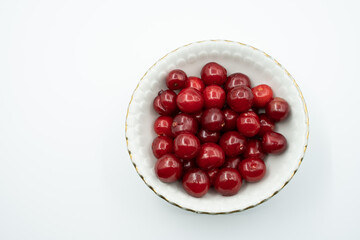 freshly picked fresh cherry grains next to each other, isolated on white background