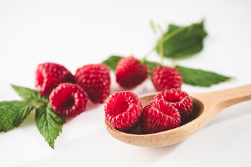 Fresh Raspberries: Juicy, Ripe Berries for a Healthy Summer Snack on a white background