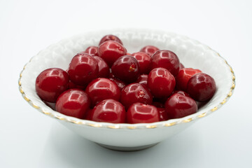 freshly picked fresh cherry grains next to each other, isolated on white background