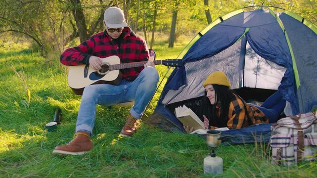 Immerse yourself in the experience of cozy camping, where you can enjoy soothing acoustic music while getting lost in an intriguing book, all set against the breathtaking beauty of nature