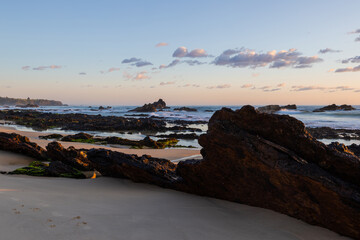 Fototapeta premium Rocky shore view of Narooma beach in the morning, NSW, Australia.