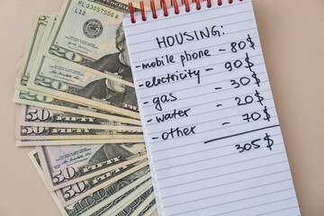 Counting receipt for utilities payment. Dollars cash money Electricity water gas price. Conservative consumption insecurity economic crisis concept. Increasing higher prices