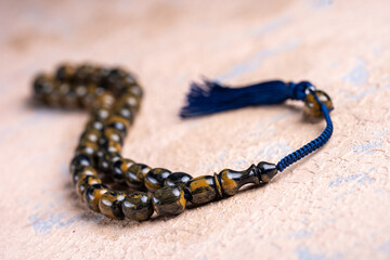 Ottoman and Turkish rosary. religious object. ( Bakelite and Amber ) Macro detail shot.