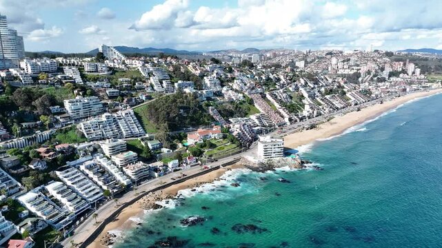 Aerial view of beautiful coastal city with sandy beach and residential buildings, Valparaiso, Chile.